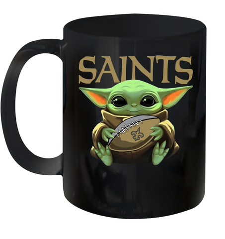 Baby Yoda Loves The New Orleans Saints Star Wars Baby Yoda Hugs Saints NFL Ceramic Mug 11oz Ceramic Mug 11oz / Black / 11oz Ceramic Mug 11oz - VeigarTee
