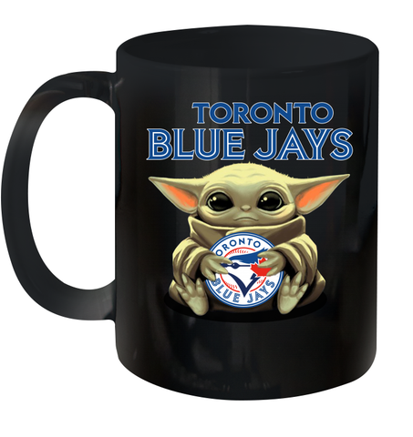 Baby Yoda Hugs Loves The Toronto Blue Jays Baseball Ceramic Mug 11oz Ceramic Mug 11oz / Black / 11oz Ceramic Mug 11oz - VeigarTee