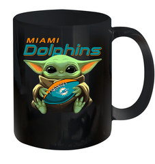 Baby Yoda Loves The Miami Dolphins Star Wars Baby Yoda Hugs Dolphins NFL Ceramic Mug 11oz Ceramic Mug 11oz - VeigarTee