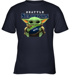 Baby Yoda Loves The Seattle Seahawks Star Wars Baby Yoda Hugs Seahawks NFL Youth T-Shirt Youth T-Shirt - VeigarTee