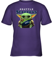 Baby Yoda Loves The Seattle Seahawks Star Wars Baby Yoda Hugs Seahawks NFL Youth T-Shirt Youth T-Shirt - VeigarTee