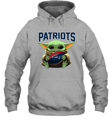 Baby Yoda Loves The New England Patriots Star Wars Baby Yoda Hugs Patriots NFL Adult Hoodie Sweatshirt Adult Hoodie Sweatshirt - VeigarTee