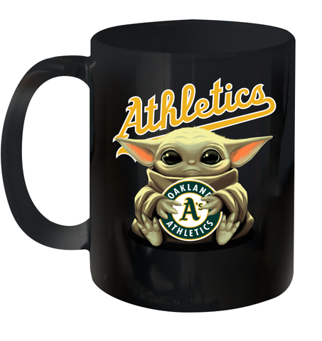Baby Yoda Hugs Loves The Oakland Athletics Baseball Ceramic Mug 11oz Ceramic Mug 11oz / Black / 11oz Ceramic Mug 11oz - VeigarTee