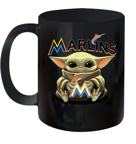 Baby Yoda Hugs Loves The Miami Marlins Baseball Ceramic Mug 11oz Ceramic Mug 11oz / Black / 11oz Ceramic Mug 11oz - VeigarTee