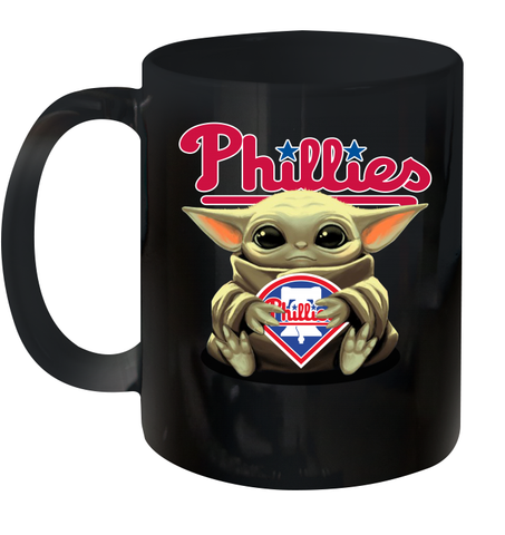 Baby Yoda Hugs Loves The Philadelphia Phillies Baseball Ceramic Mug 11oz Ceramic Mug 11oz / Black / 11oz Ceramic Mug 11oz - VeigarTee