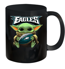 Baby Yoda Loves The Philadelphia Eagles Star Wars Baby Yoda Hugs Eagles NFL Ceramic Mug 11oz Ceramic Mug 11oz - VeigarTee