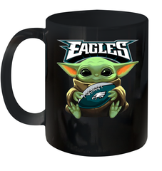 Baby Yoda Loves The Philadelphia Eagles Star Wars Baby Yoda Hugs Eagles NFL Ceramic Mug 11oz Ceramic Mug 11oz - VeigarTee